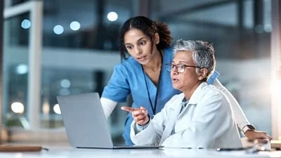 New Fast Health Clinic - Doctor pointing on the laptop